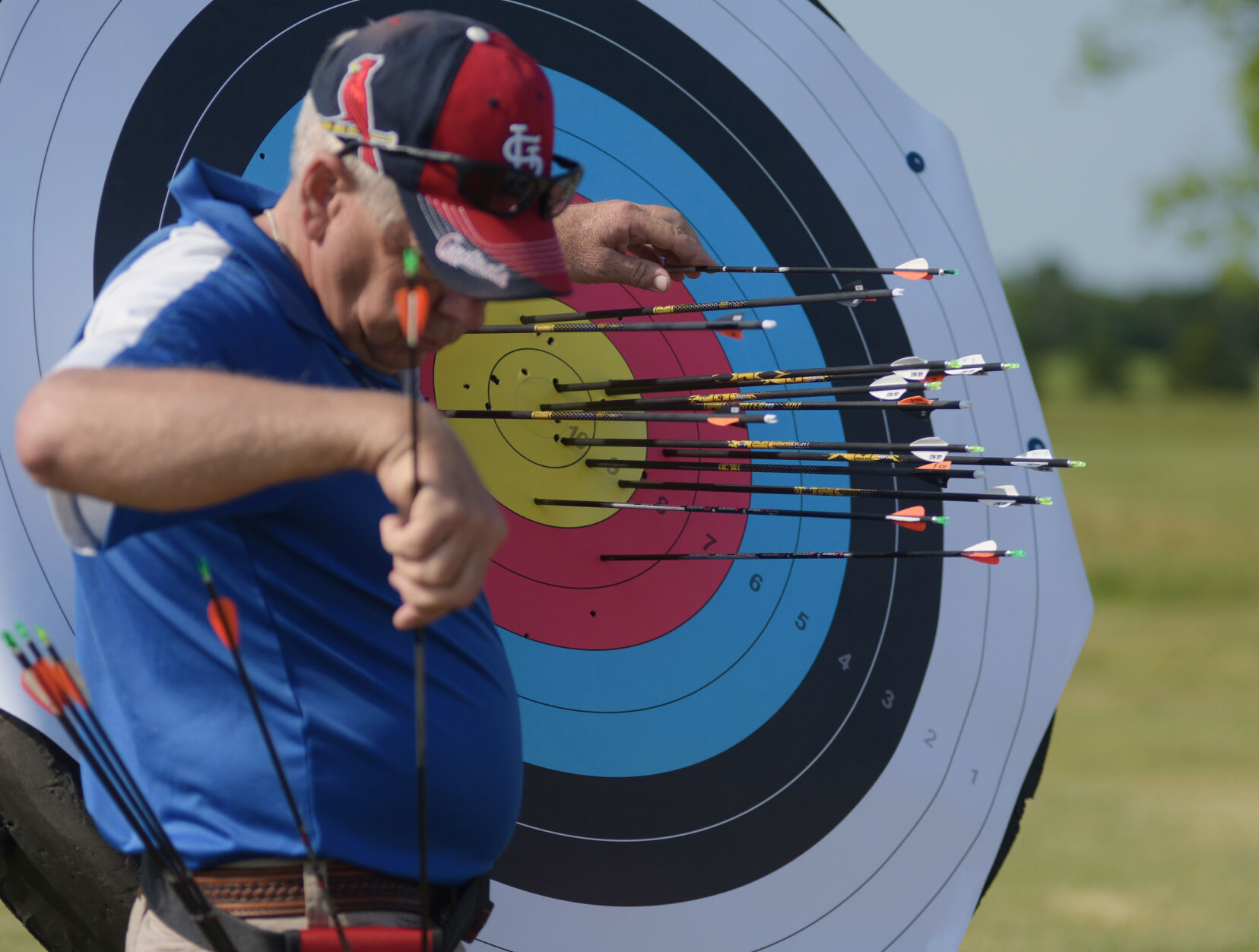 Gene Grellner pulls his arrows from the target